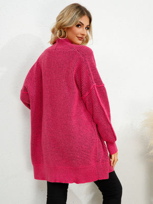Textured cocoon cardigan in hot pink with a waffle knit and relaxed fit.