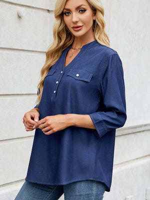 Dark navy denim henley blouse with V-neck, button placket, and two chest pockets.