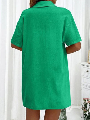 Green linen shirt with short sleeves and collar, back view