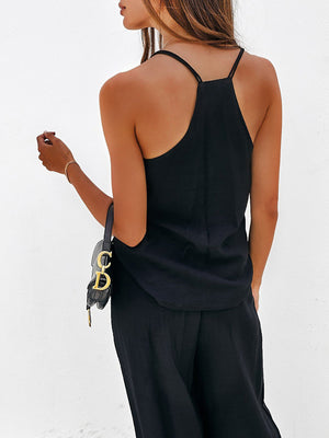 Black cami with spaghetti straps and wide-leg palazzo pants ensemble