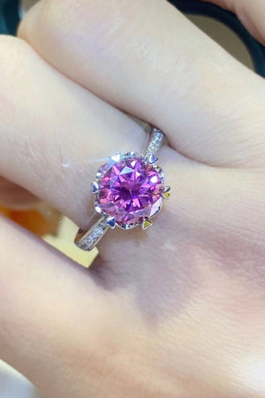 Pink moissanite ring in sterling silver with floral-inspired accents and diamond band.