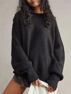 Black oversized ribbed knit sweater with drop shoulders and crew neck.