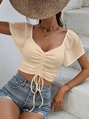 Tan ribbed crop top with chiffon sleeves and adjustable drawstring detail
