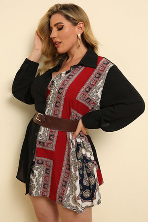 Black asymmetric paisley panel shirt dress with buttoned front and belted waist.