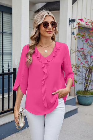 Hot pink V-neck flutter sleeve blouse with ruffled front detail.