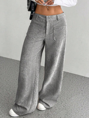 Gray corduroy wide-leg utility trousers with front patch pockets and a relaxed fit.