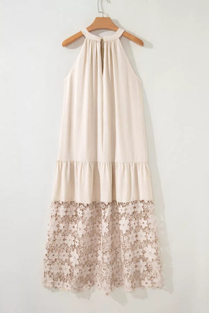 Beige halter maxi dress with tiered skirt and floral lace hem detail