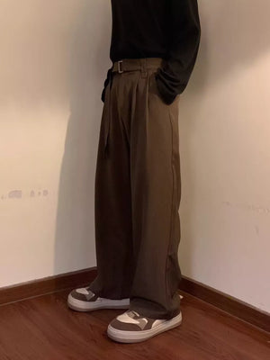 Brown wide-leg sweatpants with a belted waist and D-ring detail.