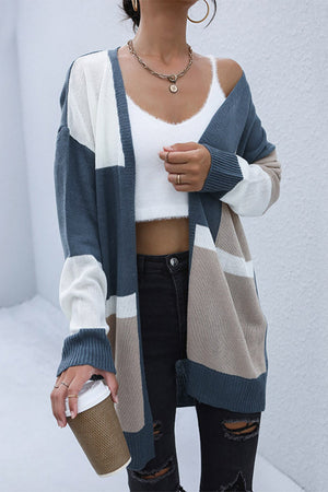 Geometric panel knit cardigan in blue, khaki, and white with a relaxed fit.