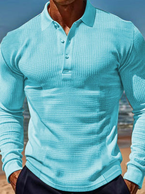 Pastel blue waffle knit long-sleeve polo shirt with button placket.