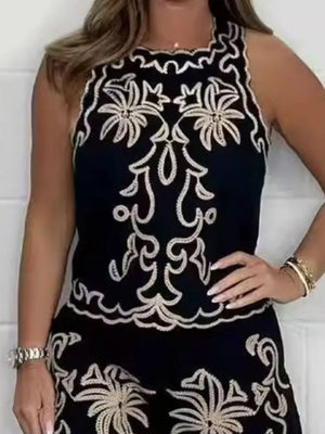 Black embroidered tank top and shorts set with ornate floral details.