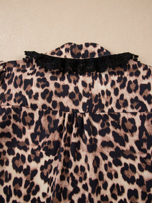 Women's leopard print shirt with black lace trim collar detail.