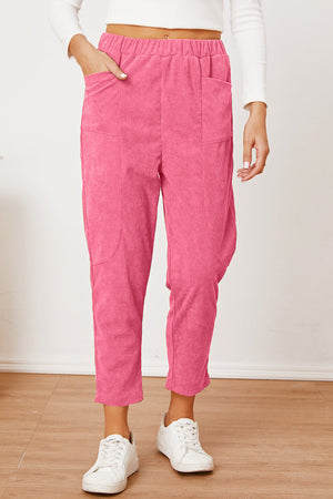 Hot Pink corduroy barrel-leg utility pants with elastic waist and patch pockets.