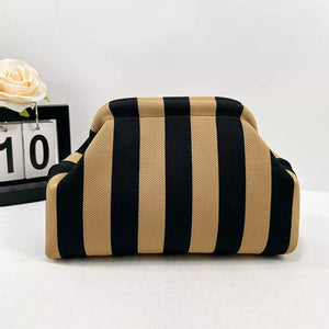 Vibrant knit clutch with black and tan vertical stripes