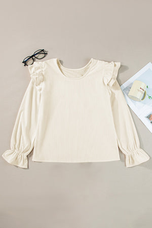 Textured ruffle sleeve blouse in eggshell with ribbed fabric and gathered cuffs.