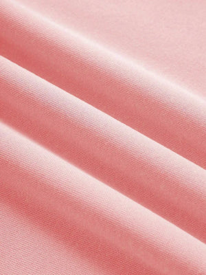 Pink graphic hoodie fabric detail with soft texture and subtle ribbing.