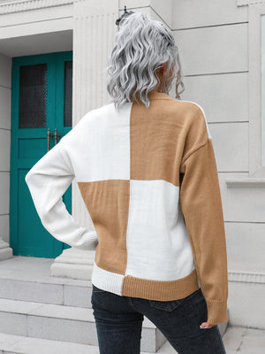Colorblock knit sweater in camel and white acrylic with a checkerboard pattern.