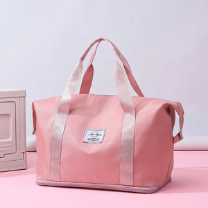 Weekend Escape Nylon Tote in Dusty Pink with dual handles and a central label.