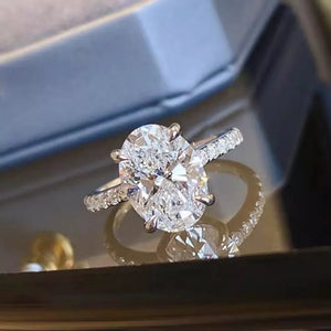 Elegant Moissanite Oval Ring In Sterling Silver with pave band