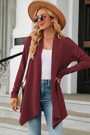 Burgundy textured knit cardigan with asymmetrical drape front and long sleeves.