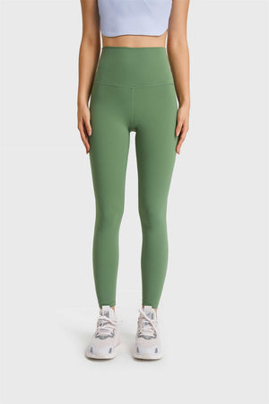 Green high rise leggings with a seamless waistband and full length legs.