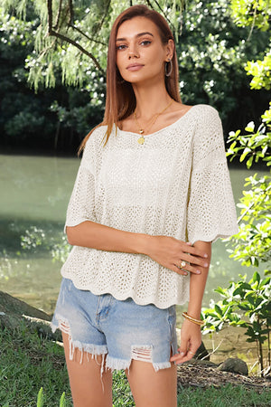 Cream open-knit top with scalloped sleeves and hem, boat neck, relaxed fit.
