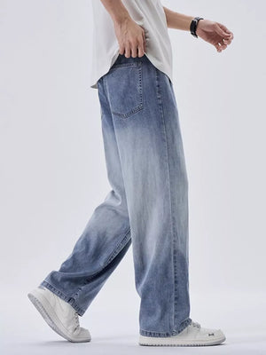Men's relaxed fit sweatpants in light blue with a vintage wash and gradient effect.