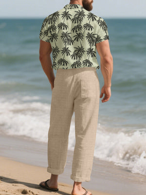 Men's relaxed fit linen pants in beige with a back pocket, cuffed hems.