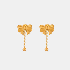 Gold bow drop chain earrings with a ball accent
