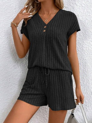 Black ribbed knit lounge set with V-neck, button detail, and drawstring shorts.