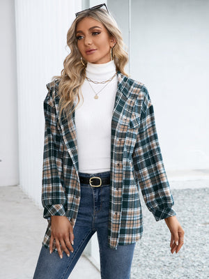 Oversized hooded shacket in deep teal plaid with snap closure and a casual, chic style.