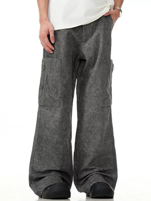 Grey wide-leg cargo pants with multiple pockets and a relaxed fit.