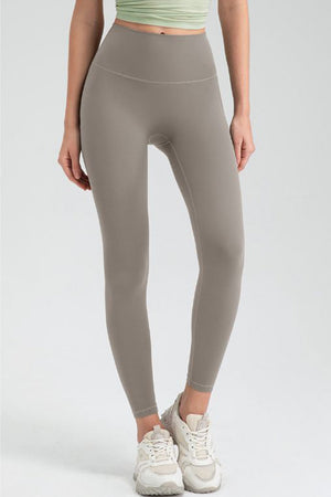 Taupe high rise leggings with a seamless waistband and full length legs.