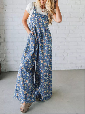 Floral denim overalls with wide legs and adjustable straps, worn with a white tee.