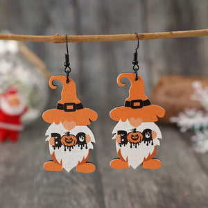Boo Gnome Halloween earrings in tangerine with pumpkin details and black hooks.