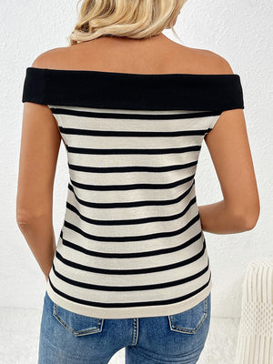 Off-shoulder knit top with black and white stripes and a black neckline.