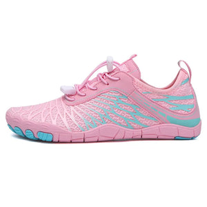 Pink adaptive mesh trail runner shoes with blue accents and quick-lace system.