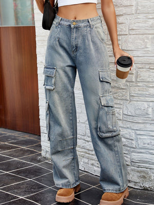 Light wash denim cargo pants with pleated waist and multiple utility pockets.