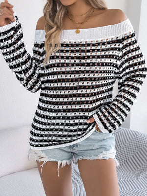 Off-shoulder striped mesh knit sweater with a white ribbed neckline and cuffs.