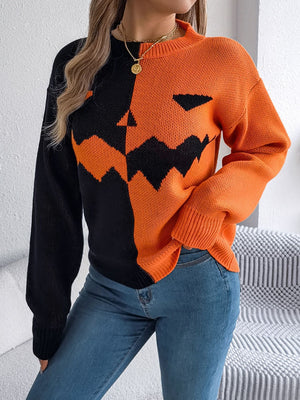 Split-face pumpkin knit sweater in orange and black acrylic with a crew neck and long sleeves.