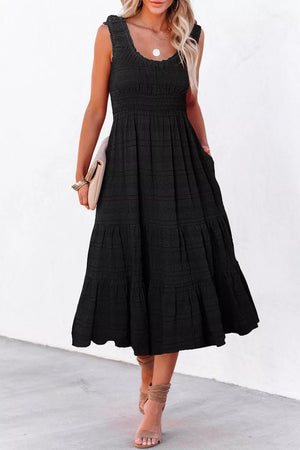 Black smocked tiered midi dress with pockets and square neckline.