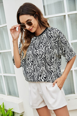 Black and white zebra print boxy tee with short sleeves and crew neck.