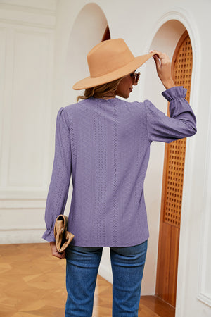 Lilac perforated sleeve blouse with ruffle cuffs and eyelet detail.
