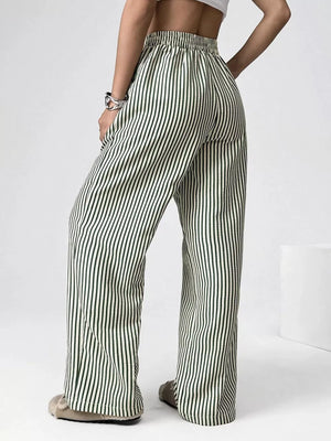 Green striped high-waisted wide-leg pants with drawstring detail.