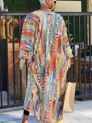 Vibrant bohemian print open-front long cardigan with abstract animal patterns and bright colors.