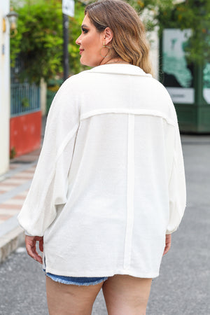 White textured oversized button-down shirt with balloon sleeves and a casual fit.