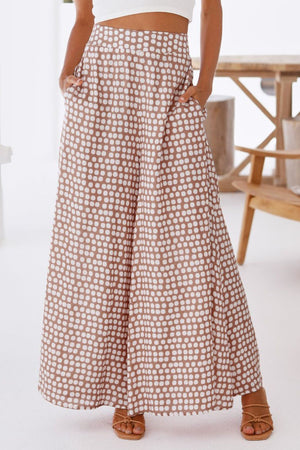 Polka dot wide leg culottes in dusty pink with pockets.