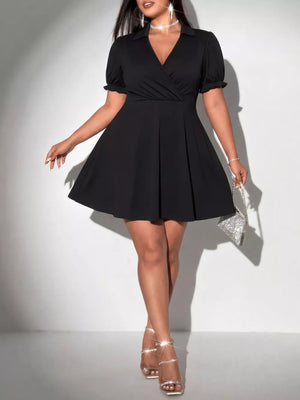 Black plus-size mini dress with surplice neckline, puff sleeves, and flared skirt.