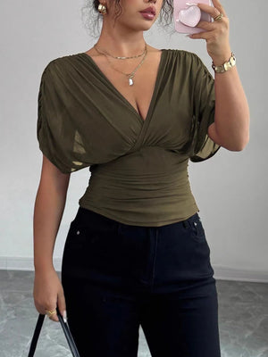 Army green ruched surplice dolman sleeve top with a deep V-neck.