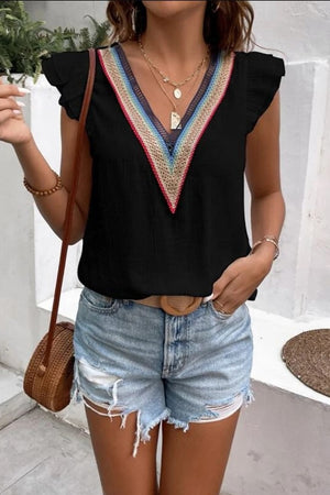 Black flutter sleeve blouse with colorful embroidered V-neck trim and ruffled sleeves.